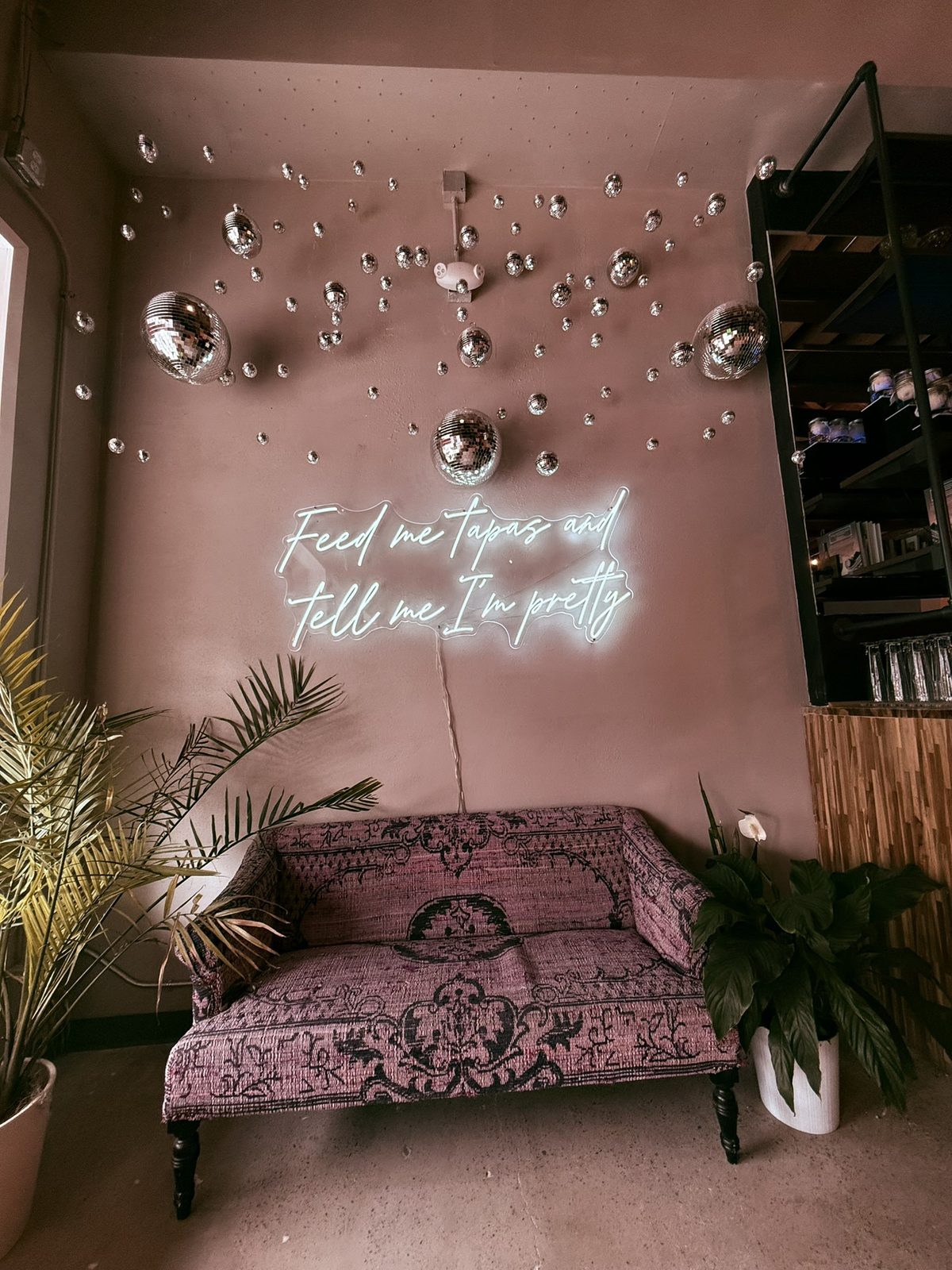 Neon sign and lounge seating at Olde Town Social