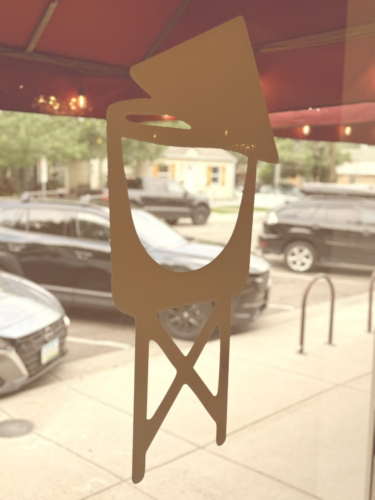 Olde Town Social water tower logo on the front window