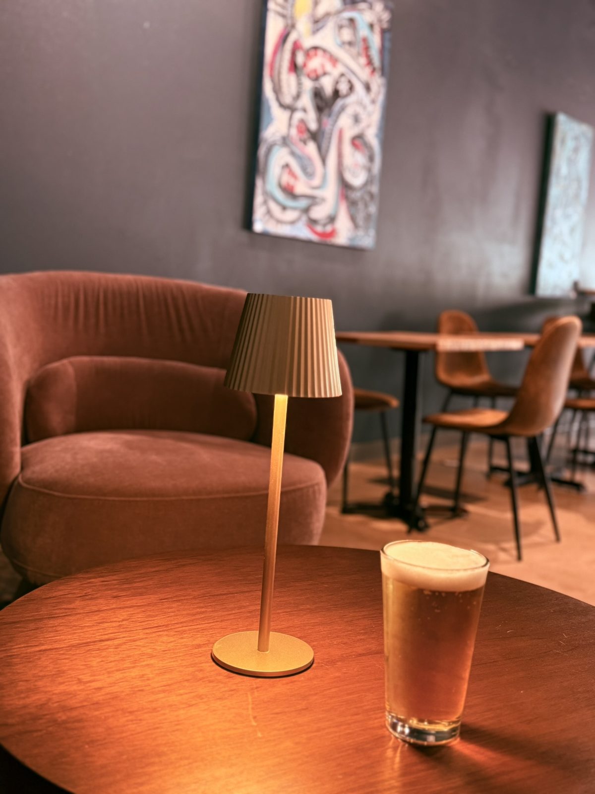 Lamp and draft beer on a lounge table