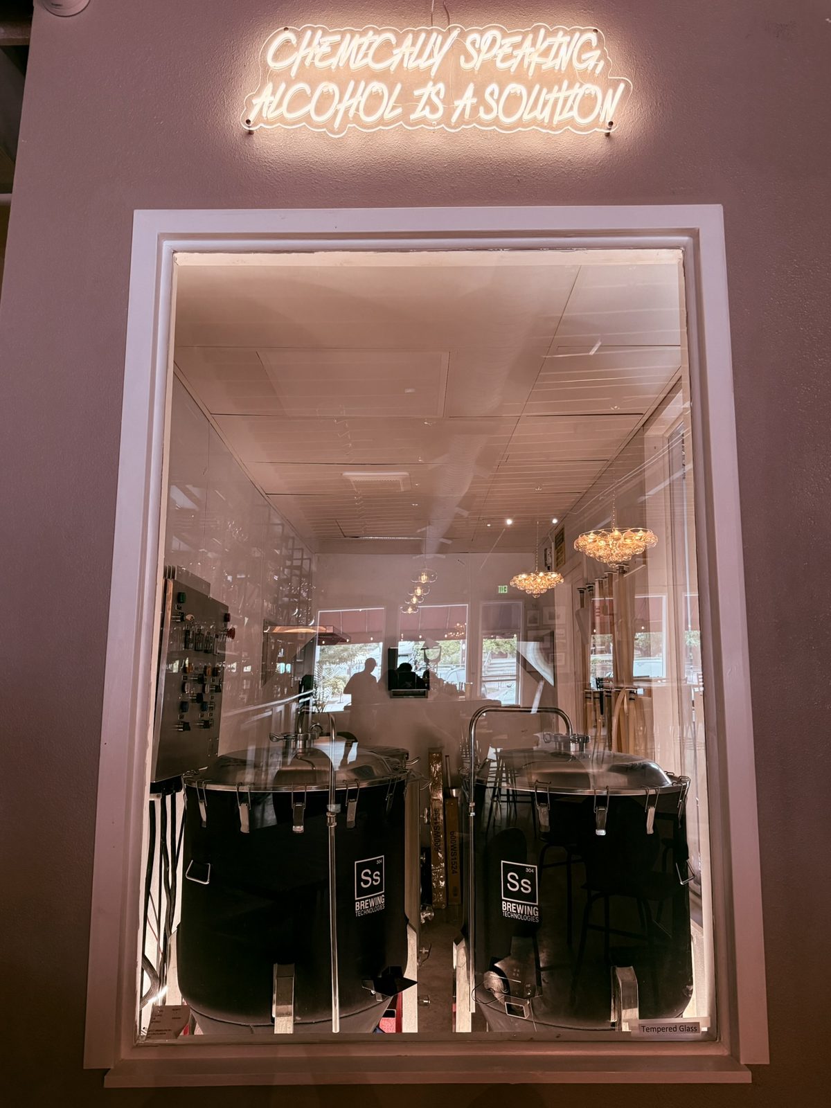 Savoie Brewing brew room window at Olde Town Social
